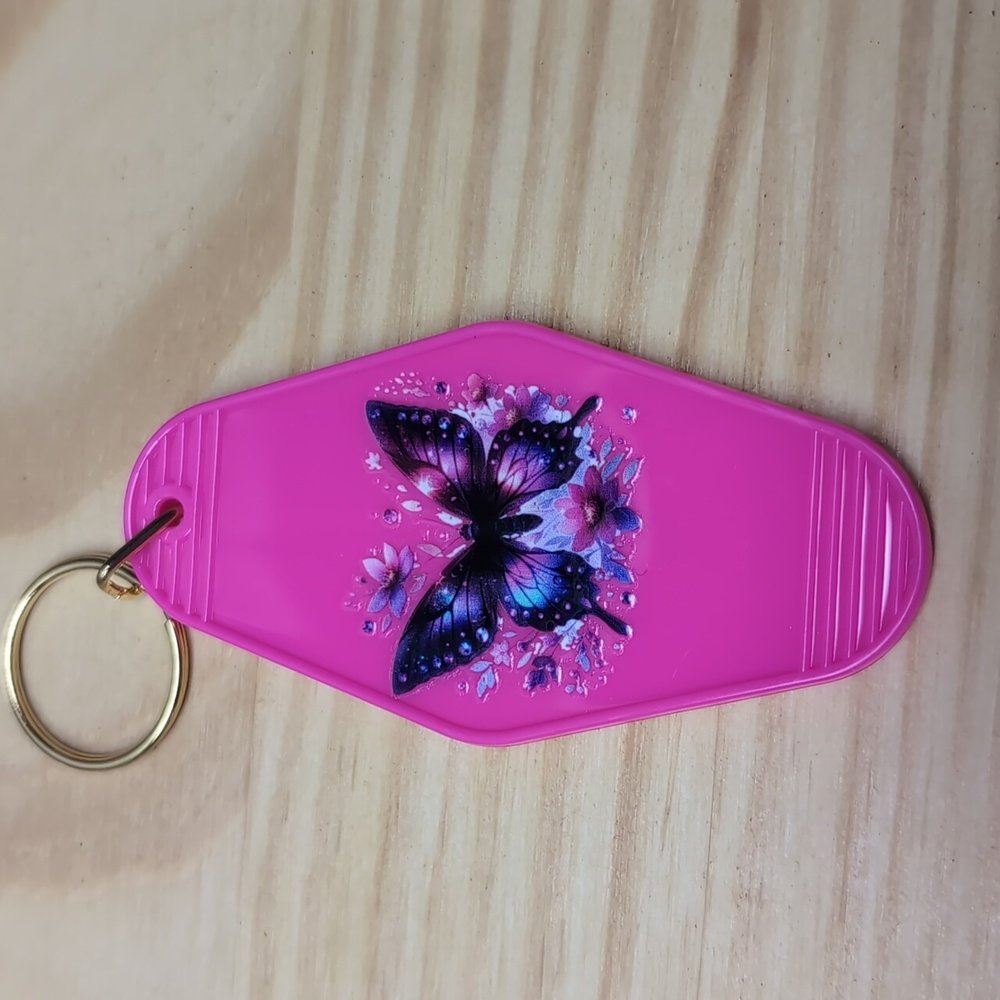 Black and purple butterfly with flowers on Pink key chain